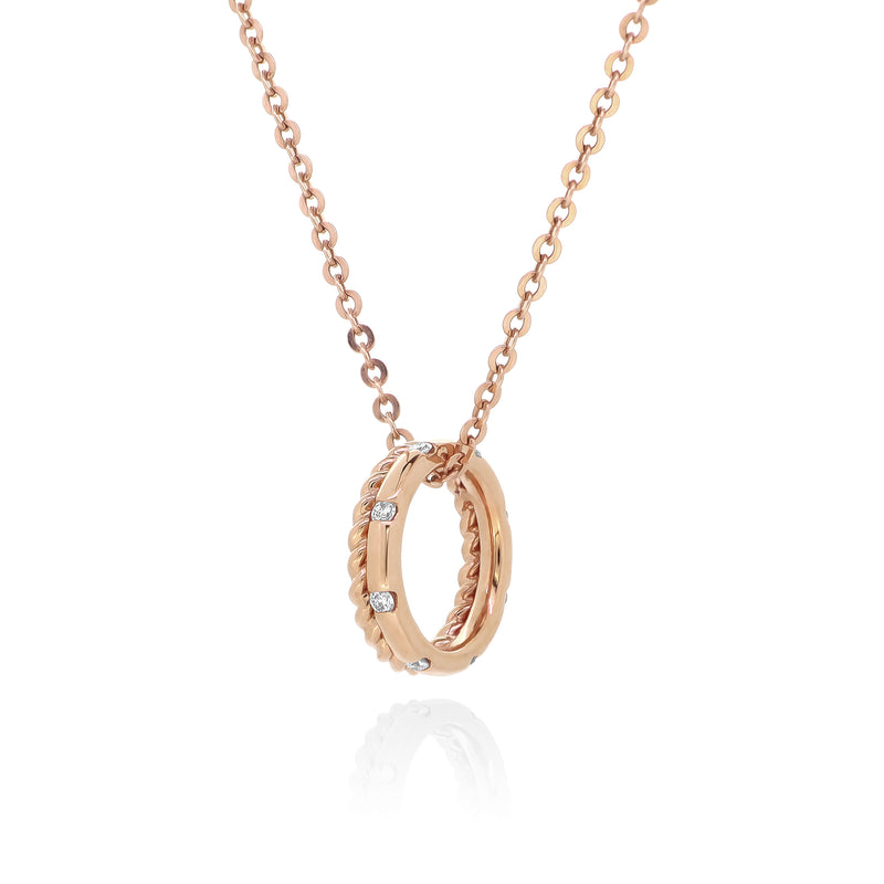 18K rose gold chain necklace with a double ring pendant. One ring features our signature twist pattern in rose gold, and the other is rose gold with ethically-sourced round brilliant diamonds