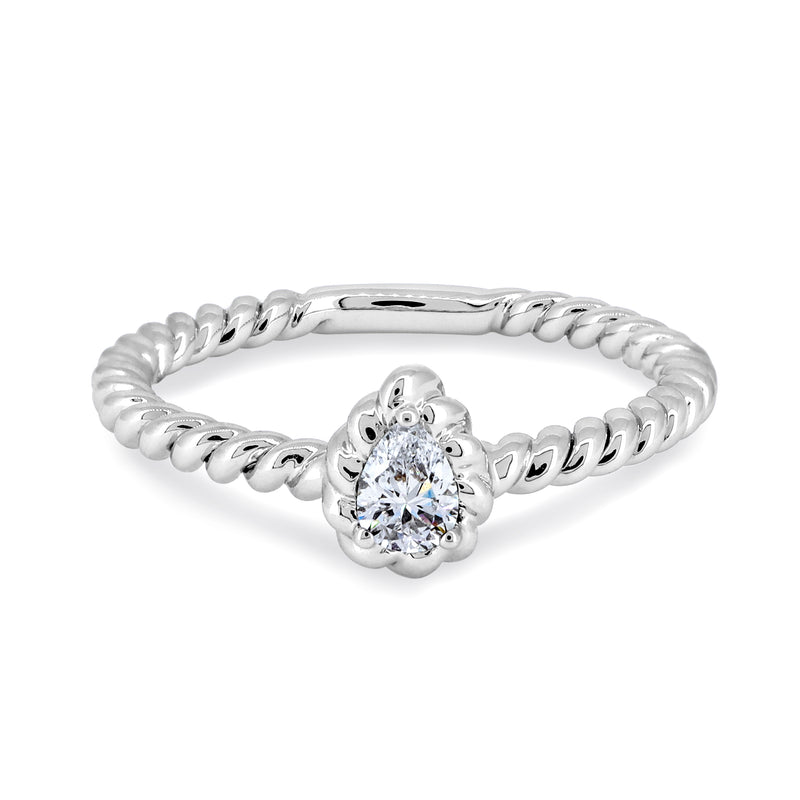 18K white gold ring with ethically-sourced pear-shaped diamond and twist band.